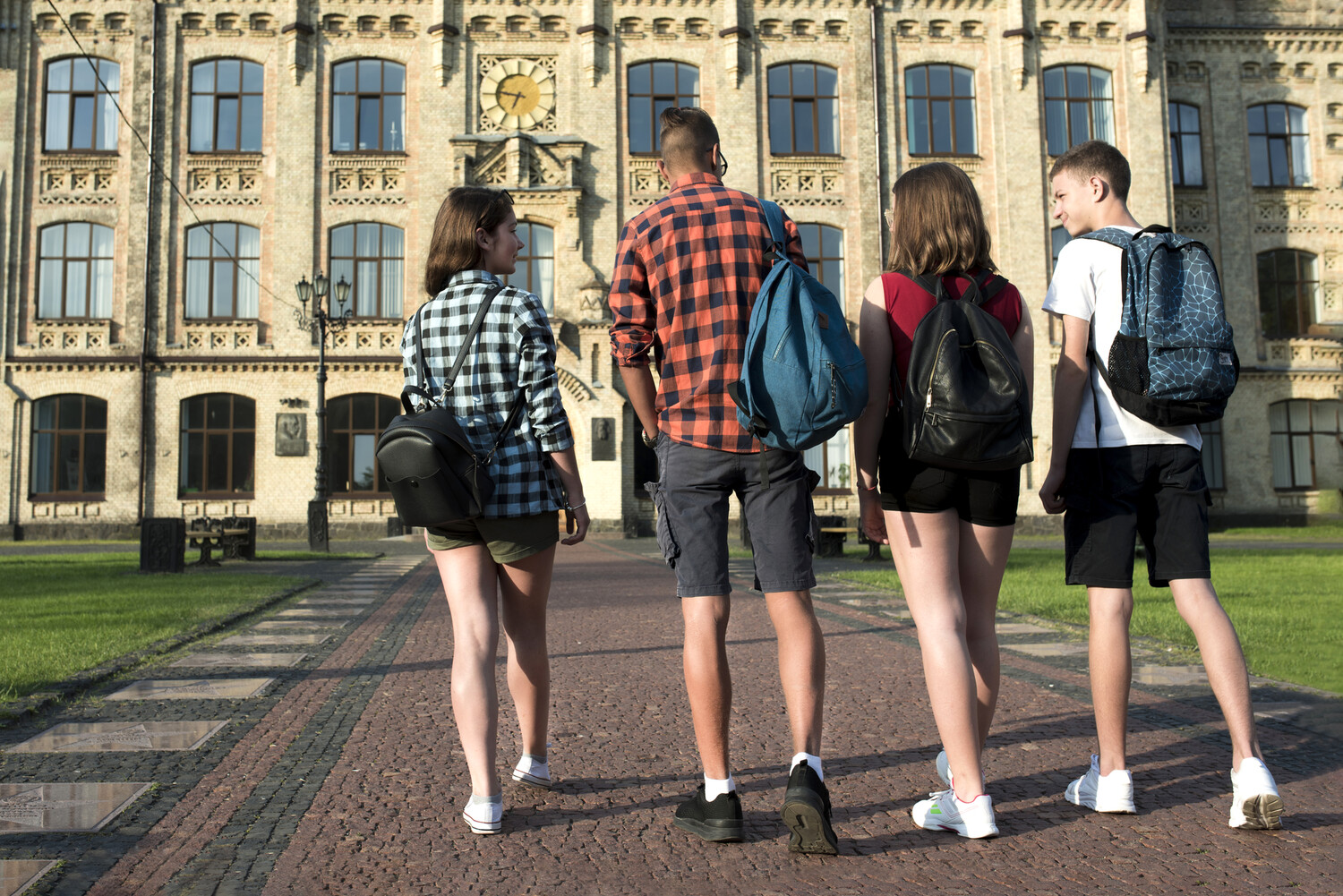 back-view-teenage-friends-going-highschool.jpg